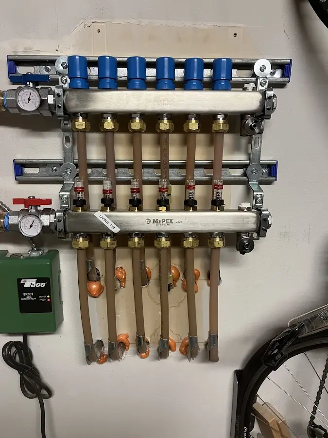 Plumber performing Water Heater Repair at a residential property in Orchard Homes